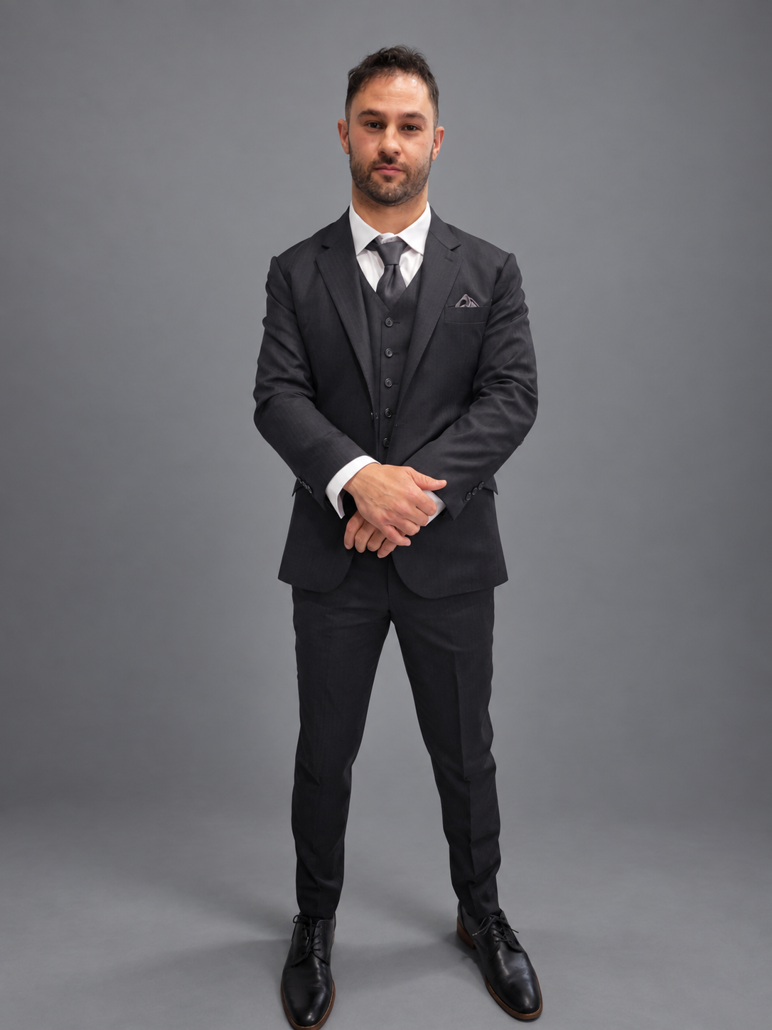 Custom charcoal three-piece suit with matching waistcoat