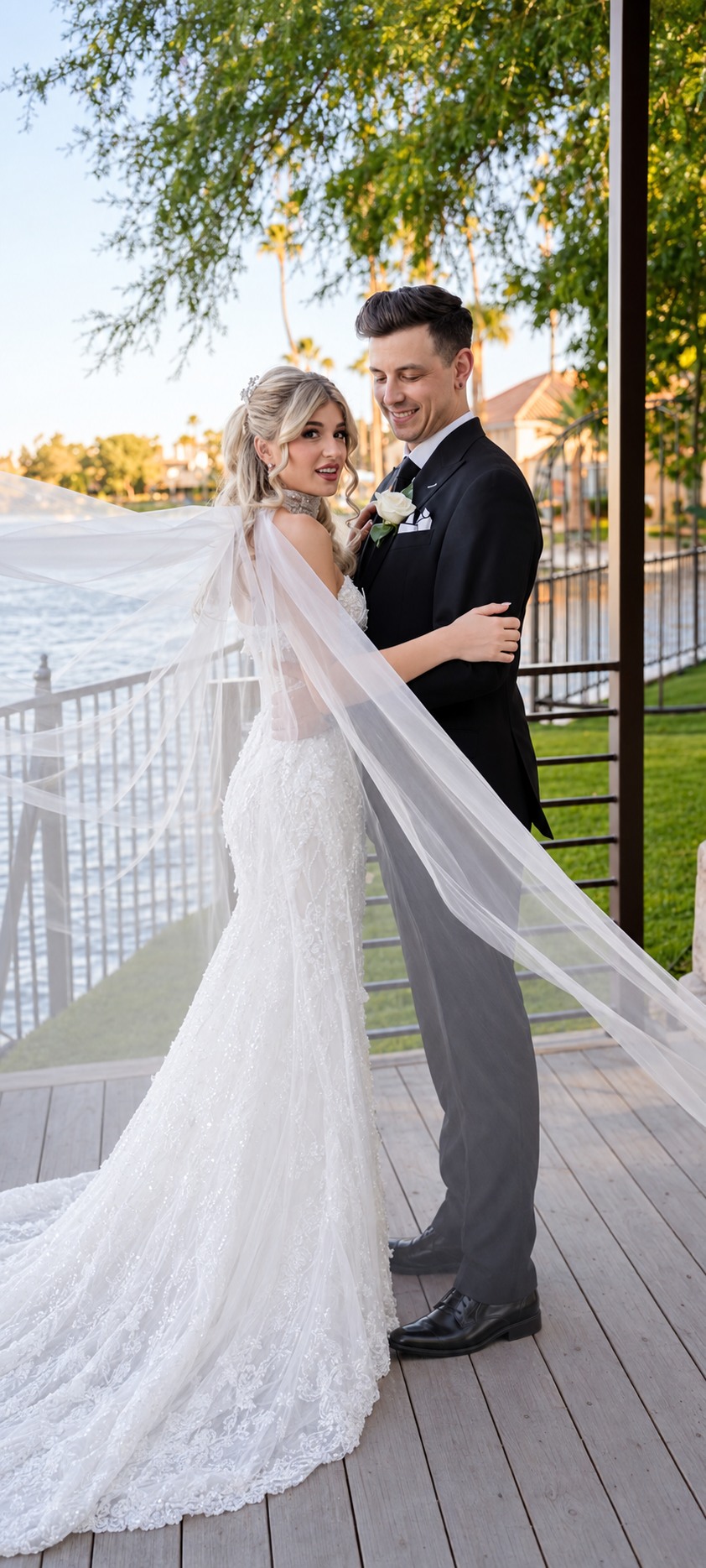 Bride and groom together, with the groom wearing a custom black wedding suit